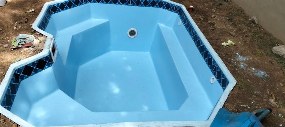 Fiberglass pool shell installation in progress in Fourways